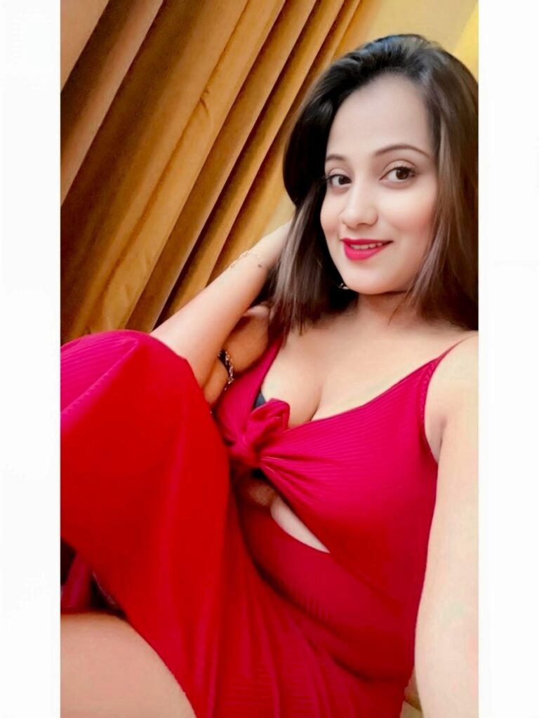 Zara independent escort red outfit sitting pose indoor stylish vibe